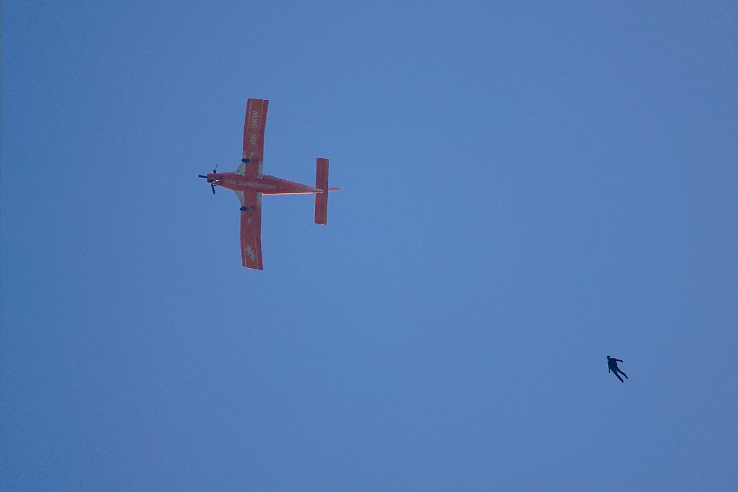 Plane and skydiver